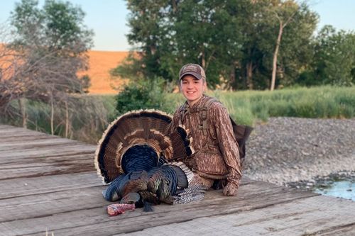 Young hunter with a spring turkey